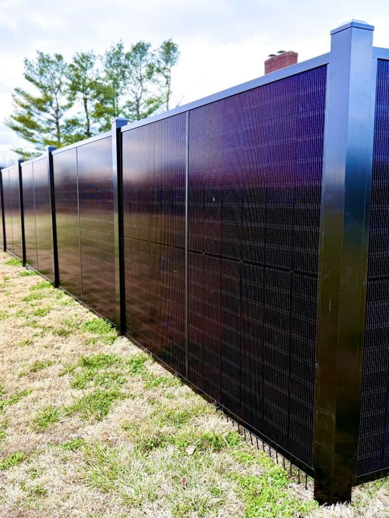 SOL Fence corner installation showing bifacial solar panels